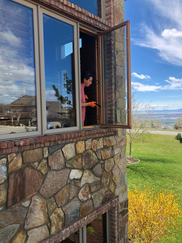 Cleaning interior windows on a home in Bountiful.